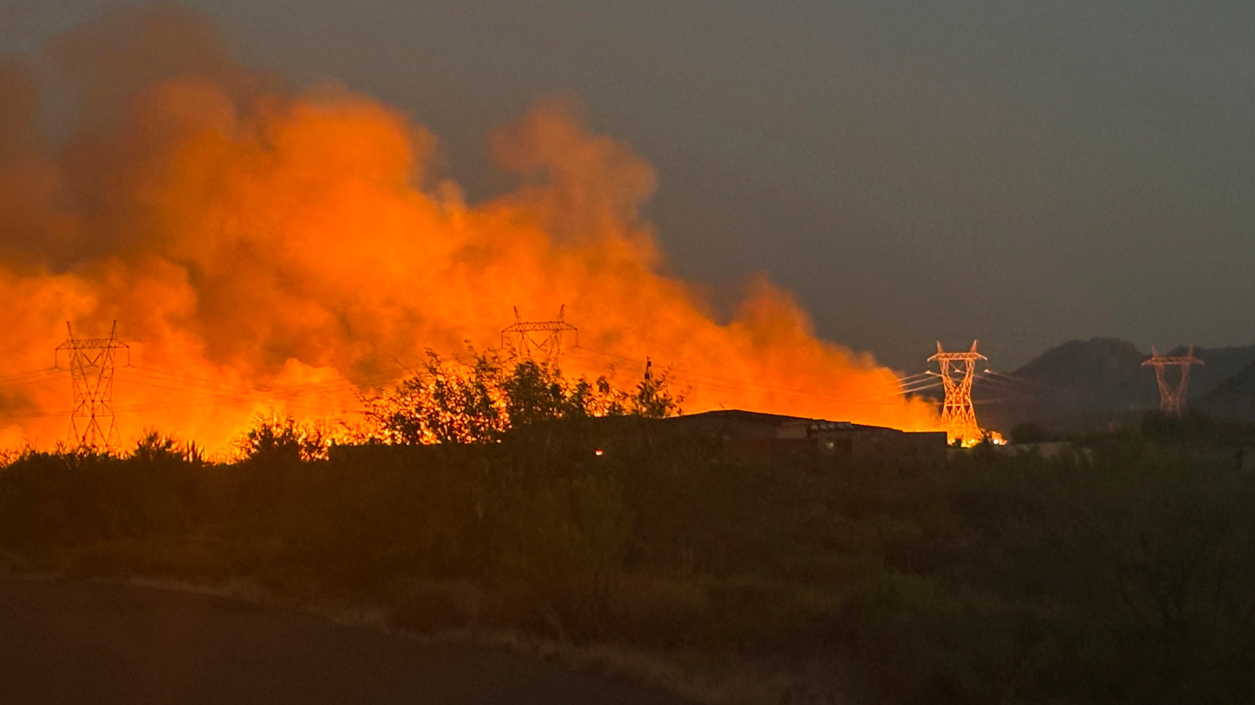 This photo released by the Arizona Department of Forestry and Fire Management shows smoke rising from the Boulder View fire Thursday, June 27, 2024, near Phoenix. Air tankers and helicopters have joined nearly 200 firefighters battling a wildfire northeast of Phoenix that has forced dozens of residents to flee their homes. (Tiffany Davila/Arizona Department of Forestry and Fire Management via AP)