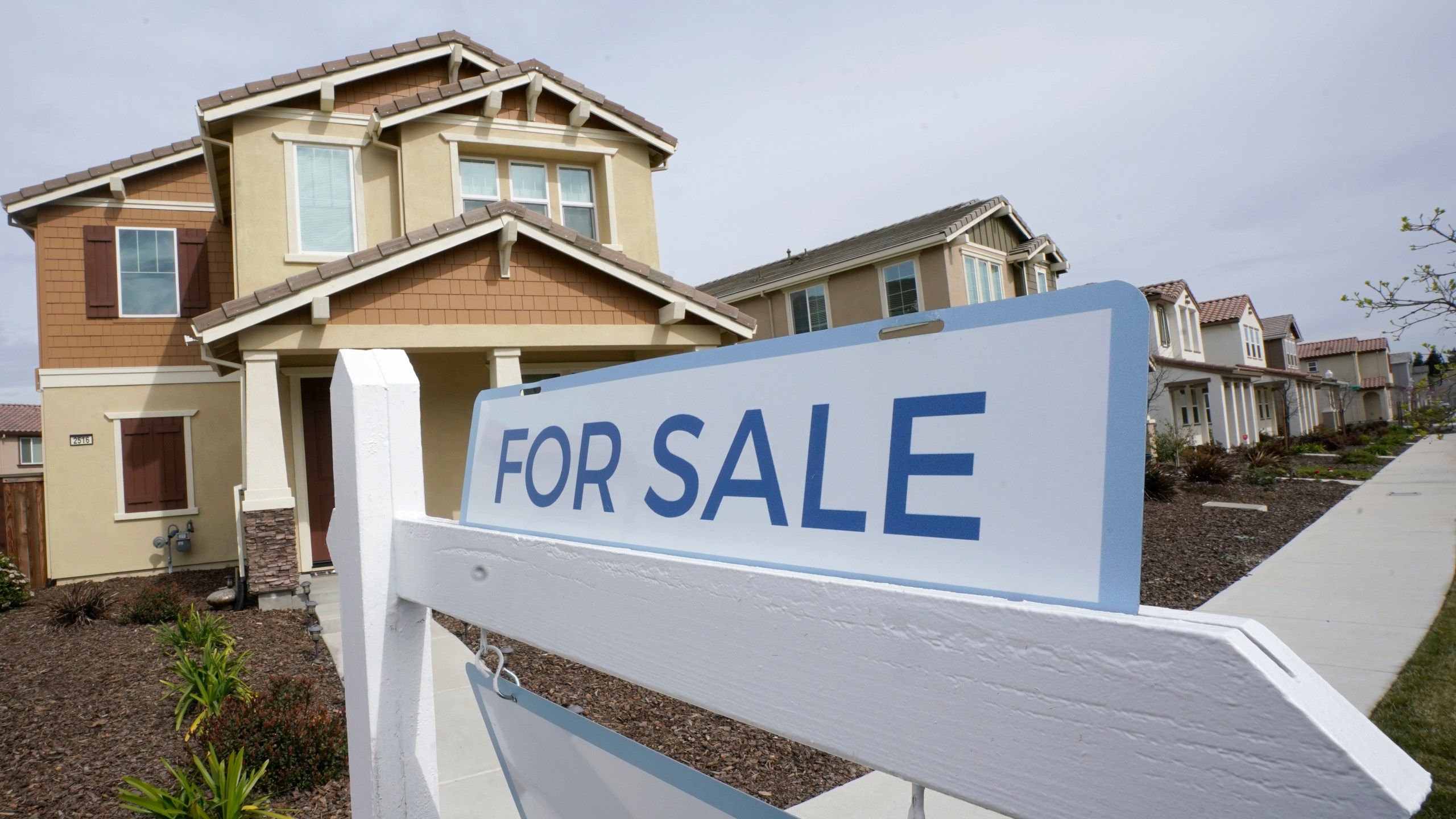 A for sale sign is posted in front of a home in Sacramento.