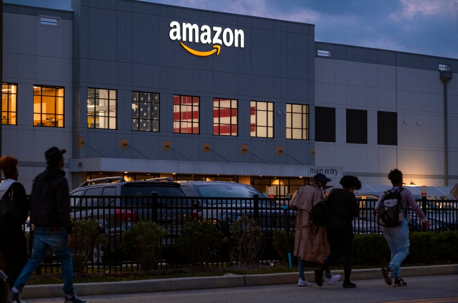 People arrive for work at the Amazon distribution center in the Staten Island borough of New York, on Oct. 25, 2021. (AP Photo/Craig Ruttle, File)