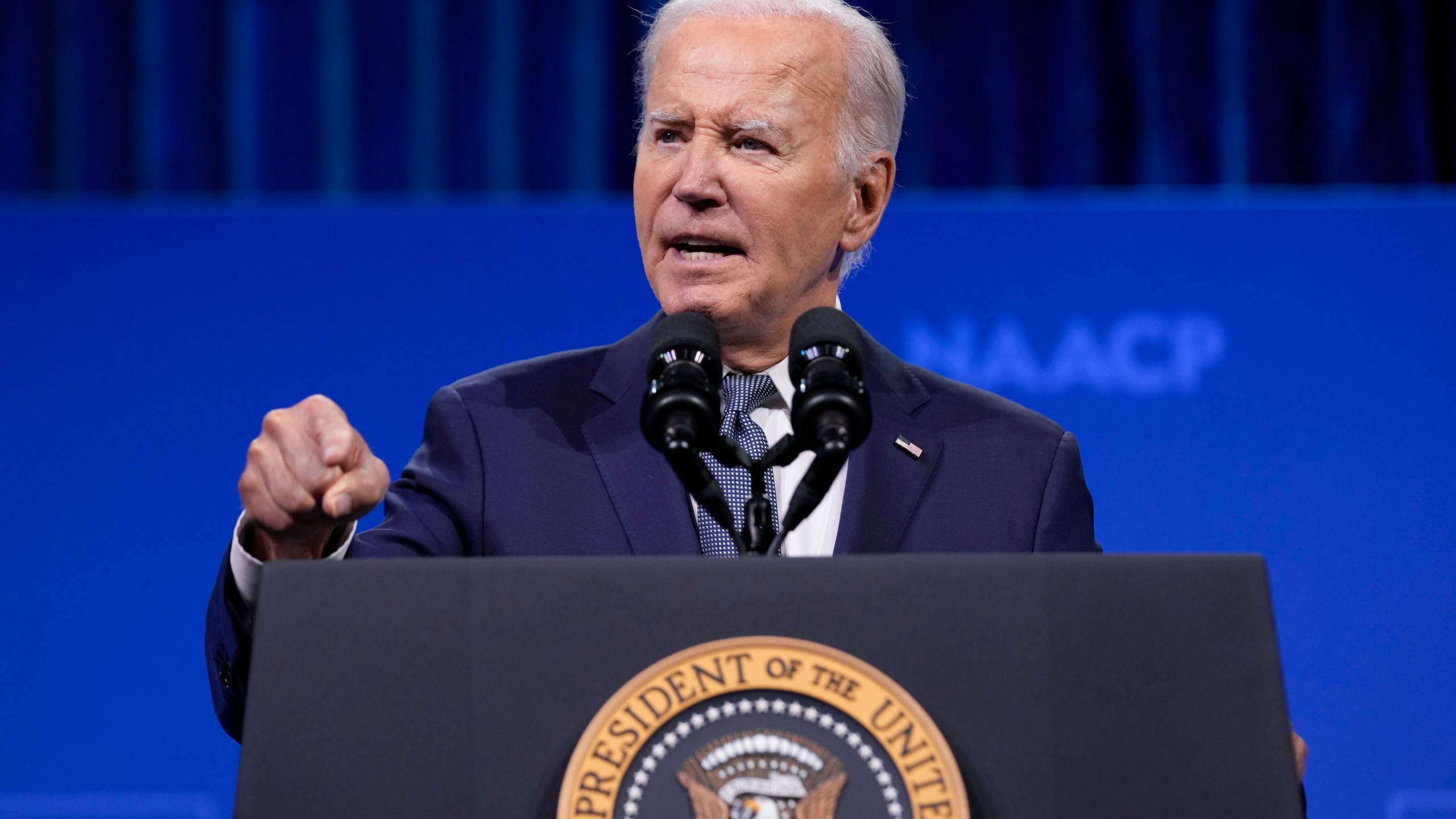 FILE - President Joe Biden speaks at the 115th NAACP National Convention in Las Vegas, July 16, 2024. Democrats at the highest levels are making a critical push for Biden to reconsider his election bid. Former President Barack Obama has privately expressed concerns to Democrats about Biden's candidacy. And Speaker Emerita Nancy Pelosi privately warned Biden that Democrats could lose the ability to seize control in the House if he didn't step away from the race. Biden says he's not dropping out believing he's best to beat the Republican Trump. (AP Photo/Susan Walsh, File)