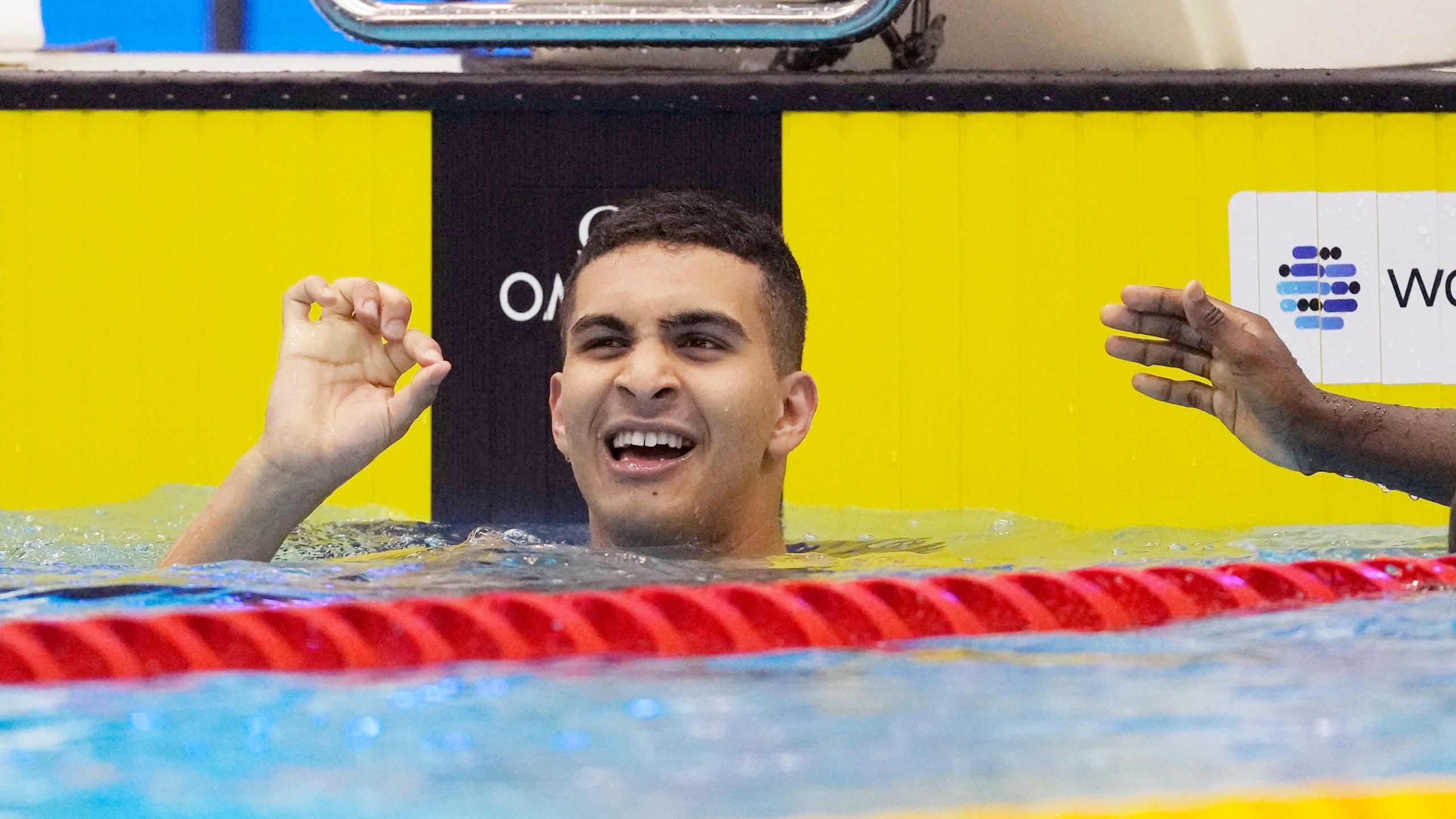 FILE – Yazan Al Bawwab, who was born in Saudi Arabia and will be competing for the Palestinian territories at the Paris Olympics, reacts during the men's 100m freestyle heats at the World Swimming Championships in Fukuoka, Japan, Wednesday, July 26, 2023. (AP Photo/Lee Jin-man, File)