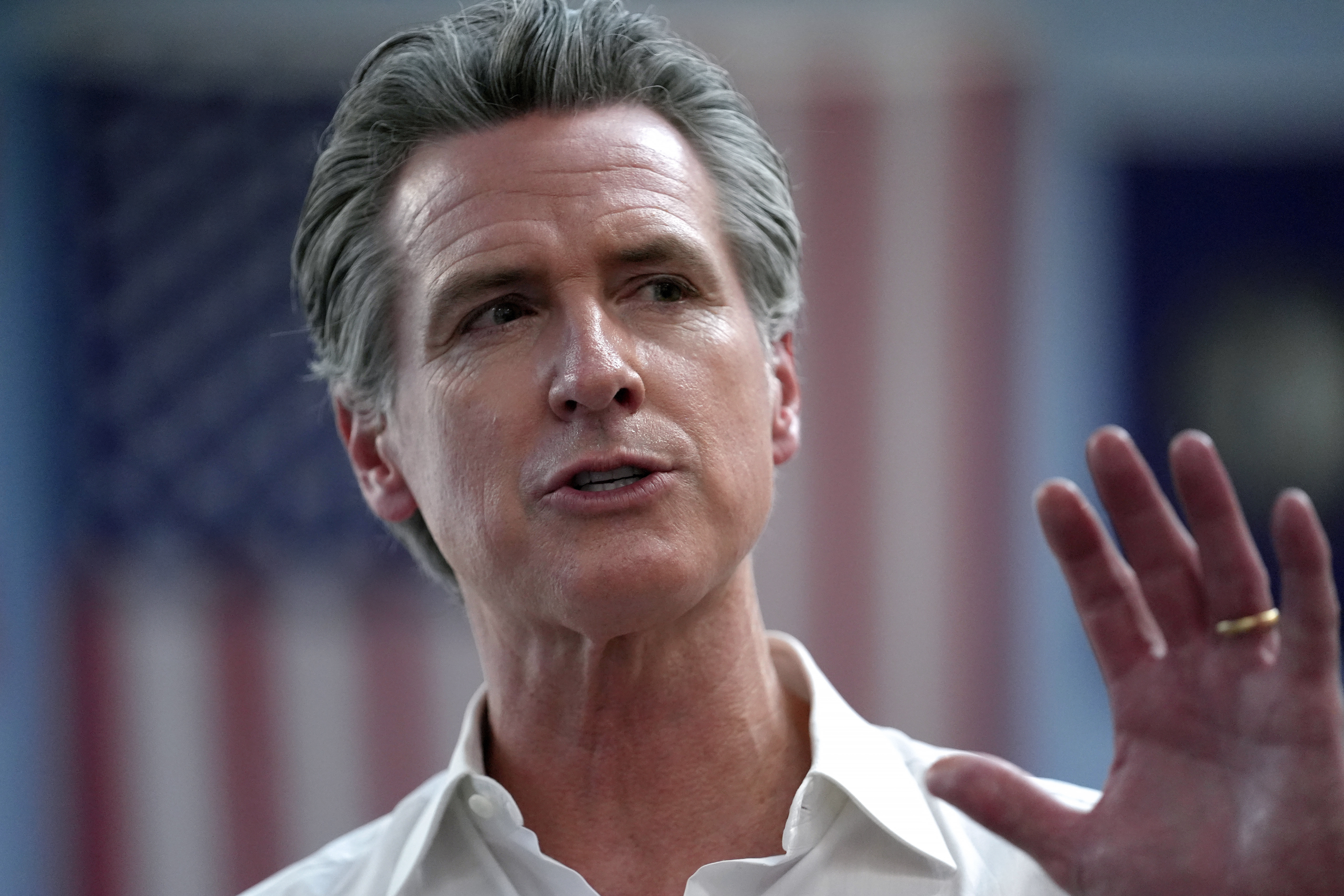 FILE - California Gov. Gavin Newsom greets people, July 8, 2024, near the Common Man Roadside Market and Deli, in Hooksett, N.H. (AP Photo/Steven Senne, File)