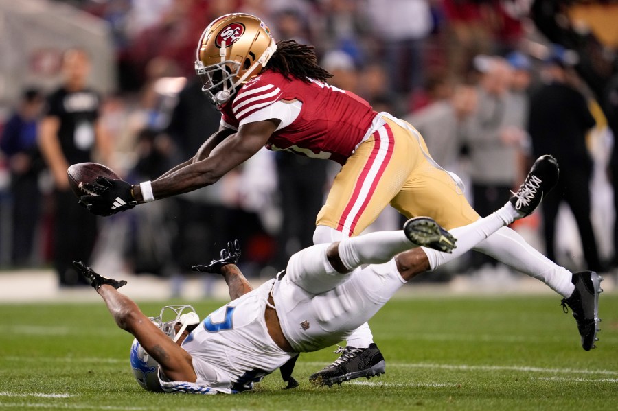 FILE - San Francisco 49ers wide receiver Brandon Aiyuk, top, catches a pass against Detroit Lions cornerback Kindle Vildor (29) during the second half of the NFC Championship NFL football game in Santa Clara, Calif., Sunday, Jan. 28, 2024. Brandon Aiyuk has requested a trade from the San Francisco 49ers because the two sides haven’t made progress on a new contract, a person familiar with the star wide receiver’s decision told The Associated Press on Tuesday, July 16.(AP Photo/Godofredo A. Vasquez, File)