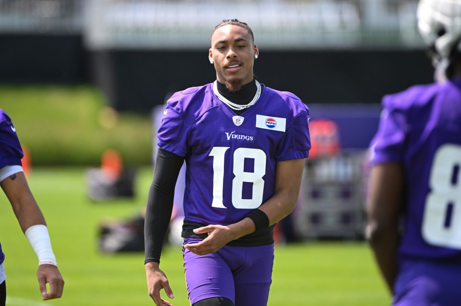 Minnesota Vikings wide receiver Justin Jefferson warms up during NFL football training camp in Eagan, Minn., Wednesday, July 24, 2024. (AP Photo/Craig Lassig)
