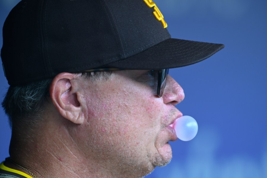 San Diego Padres manager Mike Shildt blows a bubble during the first inning inning of a baseball game against the Washington Nationals, Thursday, July 25, 2024, in Washington. (AP Photo/John McDonnell)