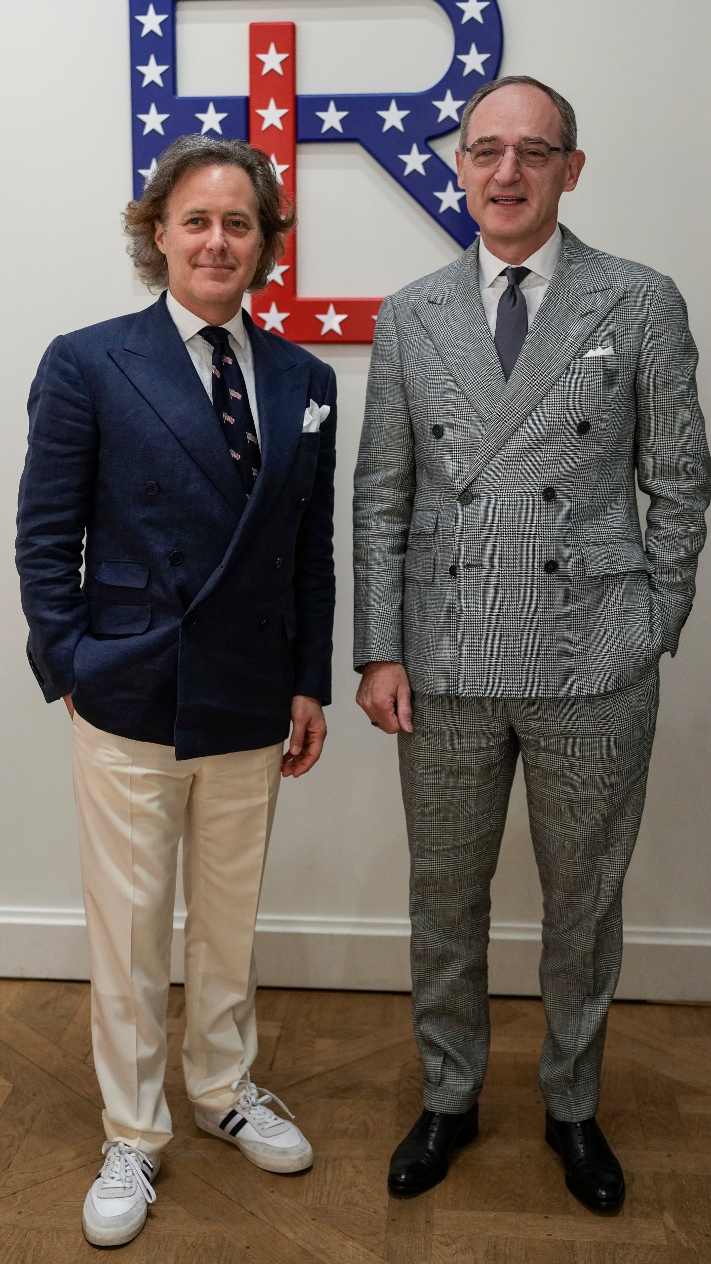 David Lauren, left, and Patrice Louvet, Chief Executive Officer of Ralph Lauren, pose for photographers upon arrival at a Ralph Lauren event during the 2024 Summer Olympics, Saturday, July 27, 2024, in Paris, France. (AP Photo/Natacha Pisarenko)