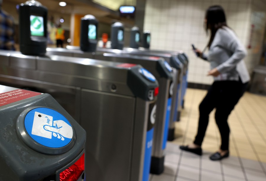 A rider taps her card to gain entry to the train at the Metro North Hollywood station Wednesday, May 29, 2024. (Getty Images)