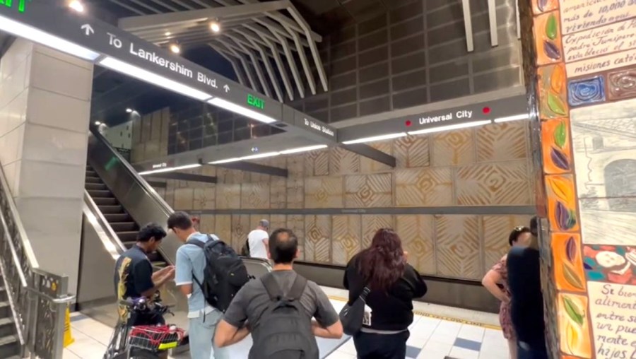 Riders wait for a subway ride at the Universal City/Studio City Metro Station. (KTLA)