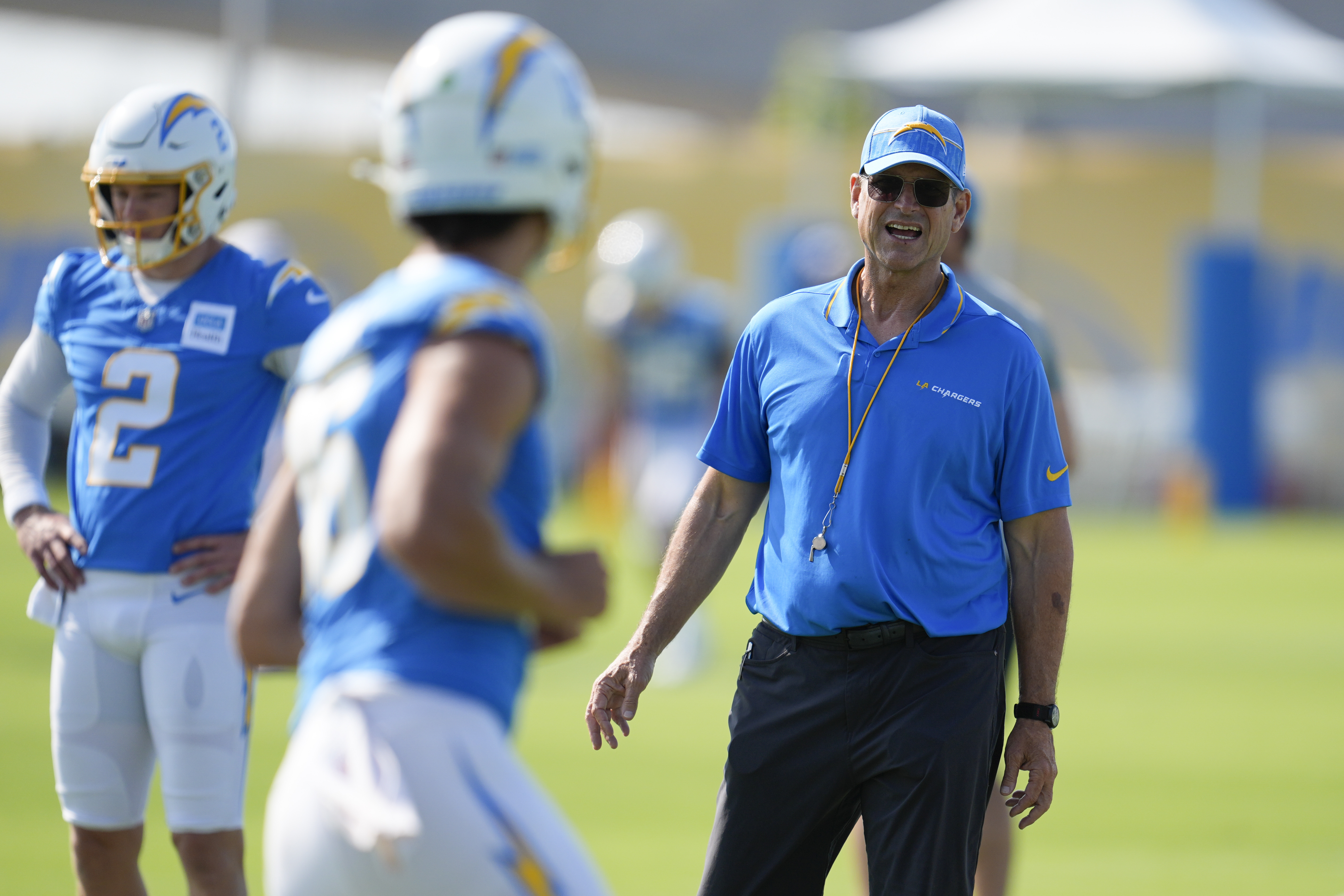 Los Angeles Chargers head coach Jim Harbaugh instructs on the field during NFL football training camp Wednesday, July 24, 2024, in El Segundo, Calif. (AP Photo/Marcio Jose Sanchez)
