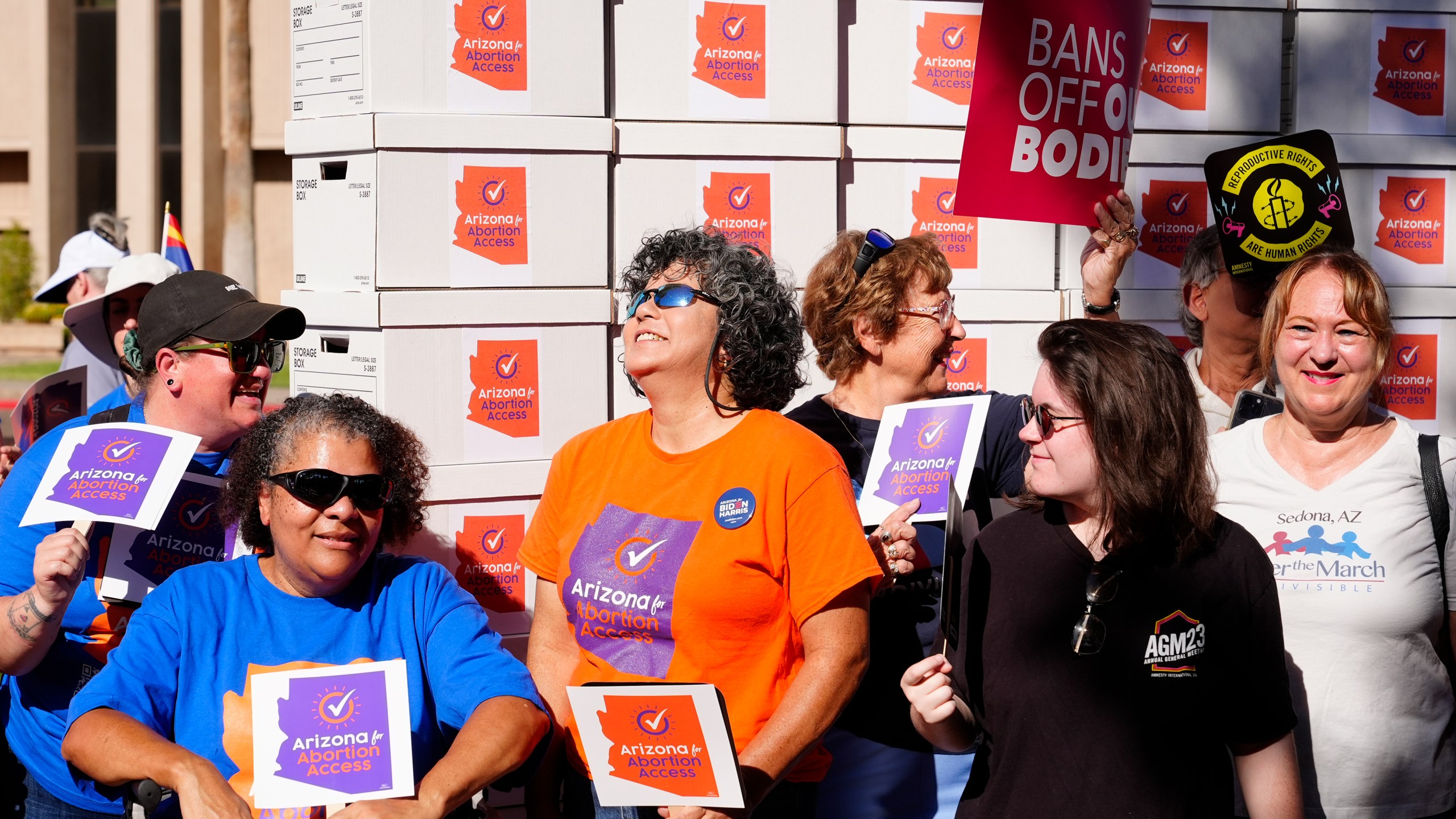 FILE - Arizona abortion-rights supporters gather for a news conference prior to delivering more than 800,000 petition signatures to the state Capitol to get abortion rights on the November general election ballot, July 3, 2024, in Phoenix. (AP Photo/Ross D. Franklin, File)
