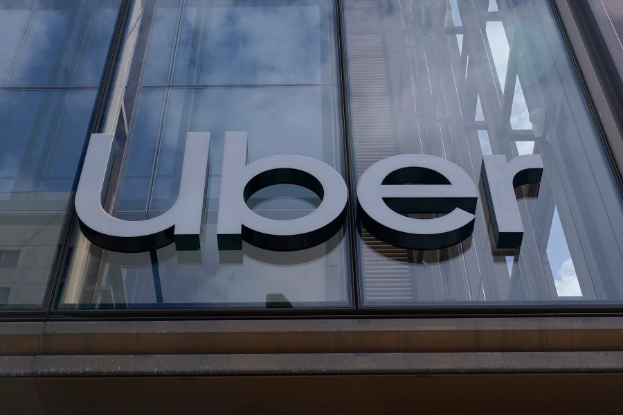 FILE - An Uber sign is displayed at the company's headquarters in San Francisco, Sept. 12, 2022. (AP Photo/Jeff Chiu, File)