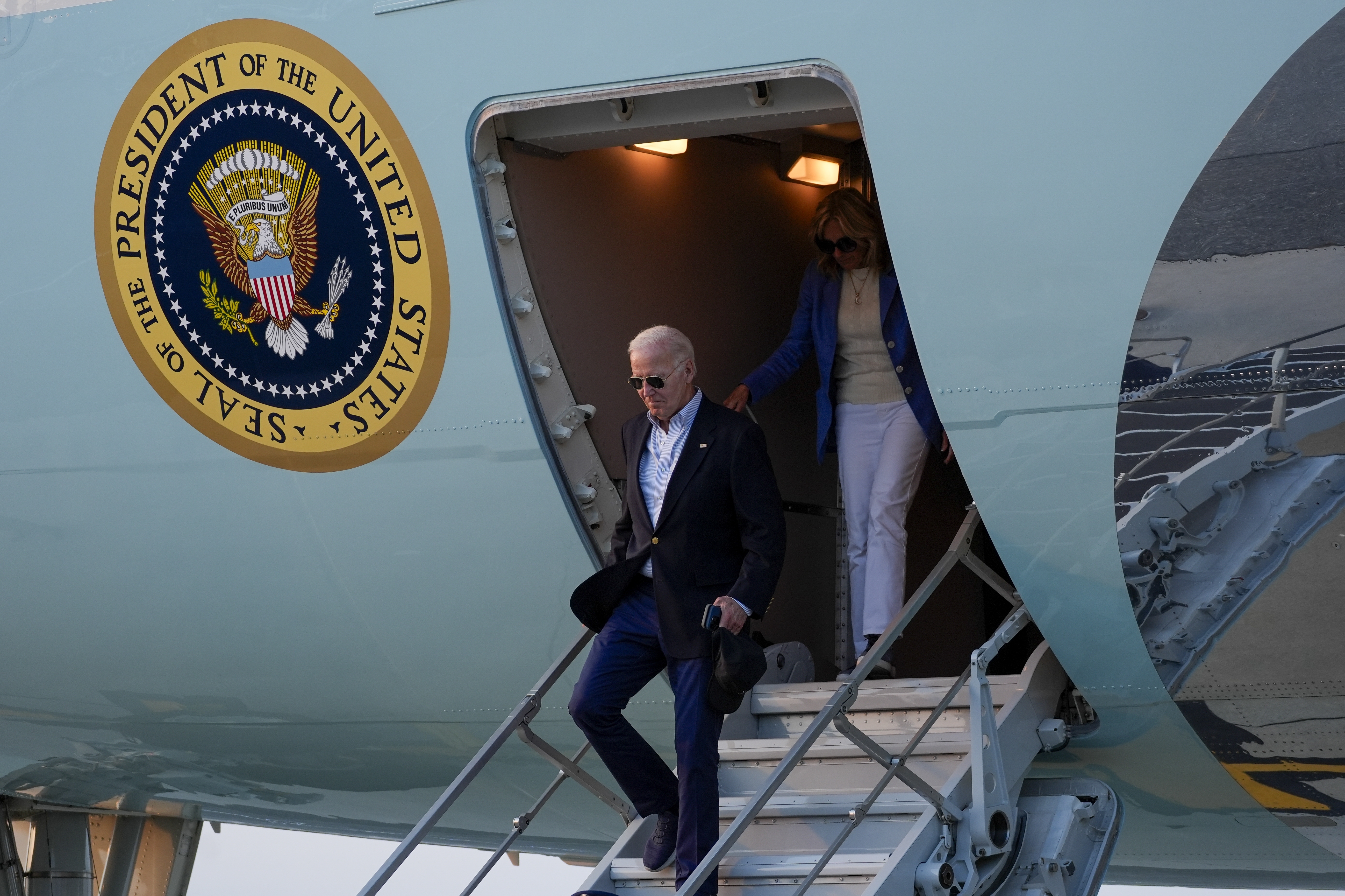 President Joe Biden and first lady Jill Biden arrive on Air Force One at Dover Air Force Base in Dover, Del., Sunday, Aug. 25, 2024. (AP Photo/Stephanie Scarbrough)