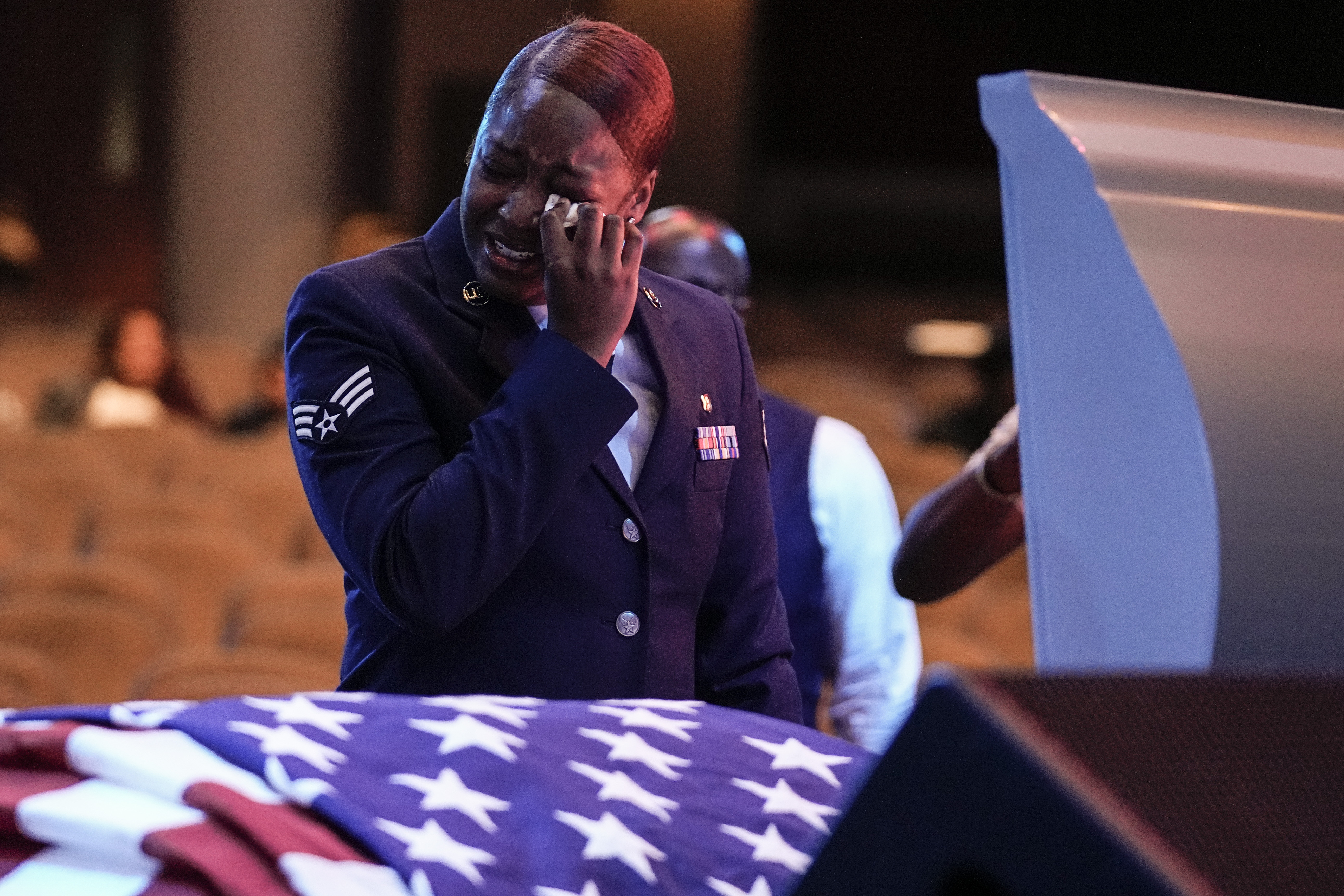 FILE - U.S. Air Force personnel stand near the coffin of slain airman Roger Fortson during his funeral at New Birth Missionary Baptist Church, Friday, May 17, 2024, near Atlanta. (AP Photo/Brynn Anderson, File)