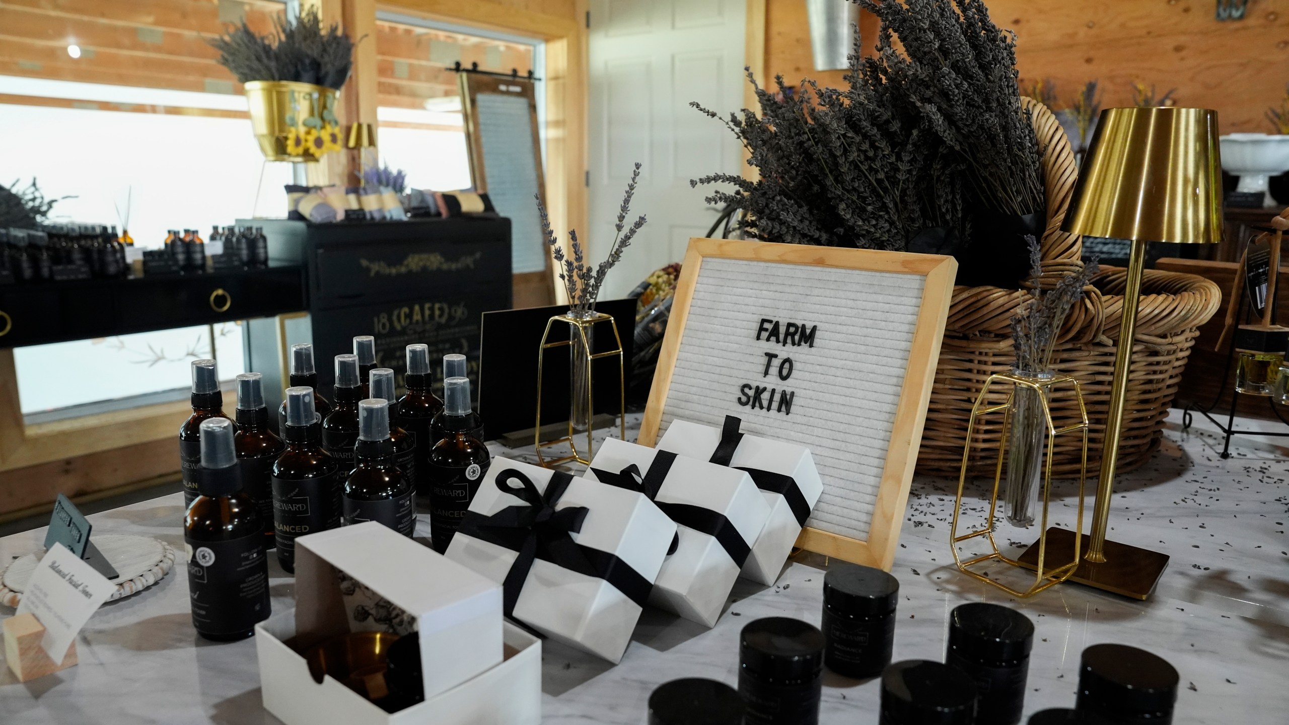 Lavender-infused beauty products sit out for sale, Wednesday, Aug. 21, 2024, at Hereward Farms in East Garafraxa, Ontario. (AP Photo/Joshua A. Bickel)