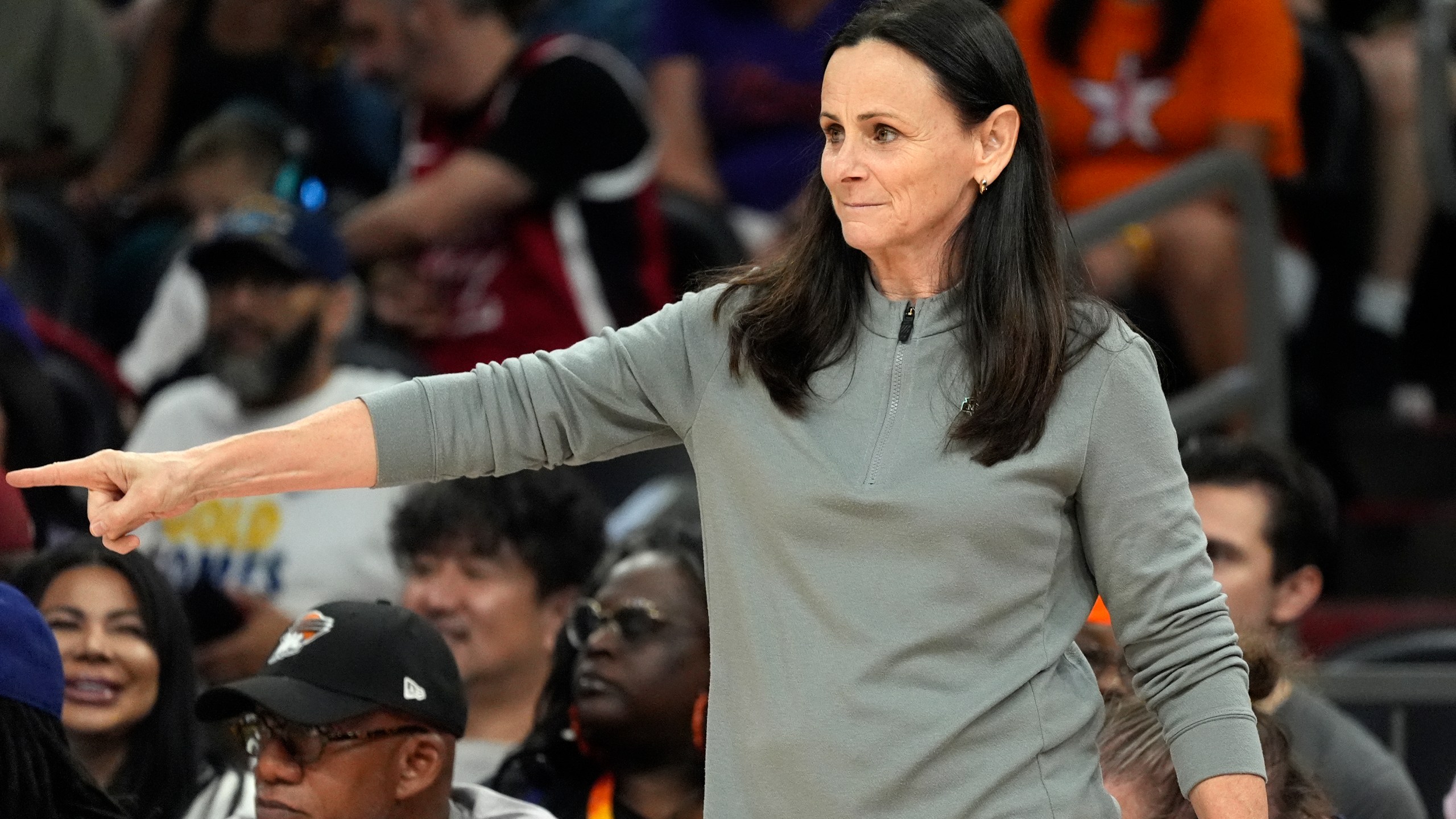 New York Liberty head coach Sandy Brondello gives instructions to players on the court during the first half of a WNBA basketball game against the Phoenix Mercury, Monday, Aug. 26, 2024, in Phoenix. (AP Photo/Ross D. Franklin)