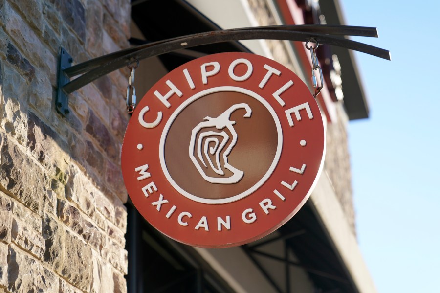 FILE - The Chipotle Mexican Grill logo hangs outside a restaurant location, Dec. 20, 2022, in Westwood, Mass. . (AP Photo/Steven Senne, File)