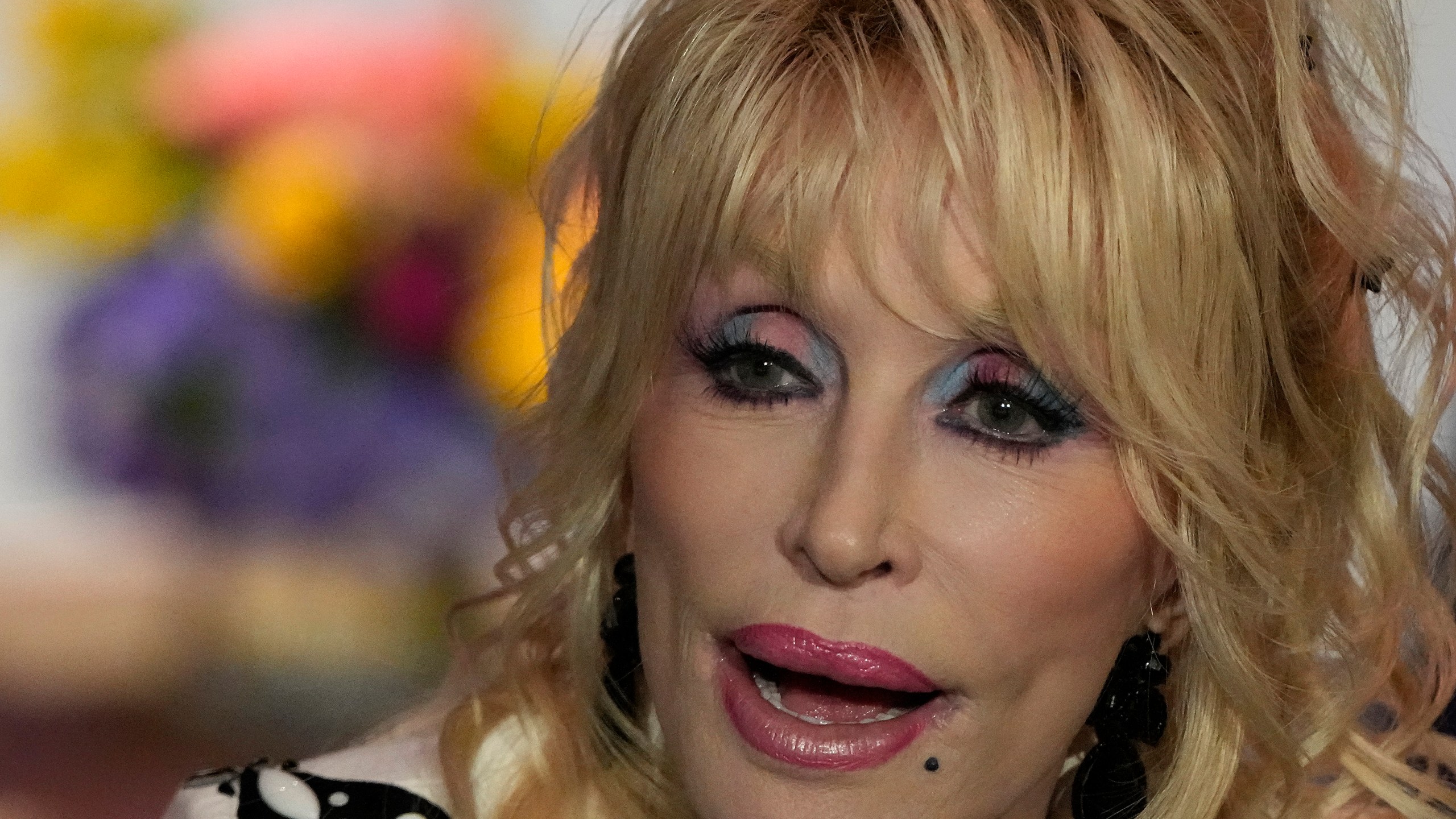 Dolly Parton performs during an event celebrating the Missouri statewide expansion of Dolly Parton's Imagination Library, Tuesday, Aug. 27, 2024, in Kansas City, Mo. (AP Photo/Charlie Riedel)