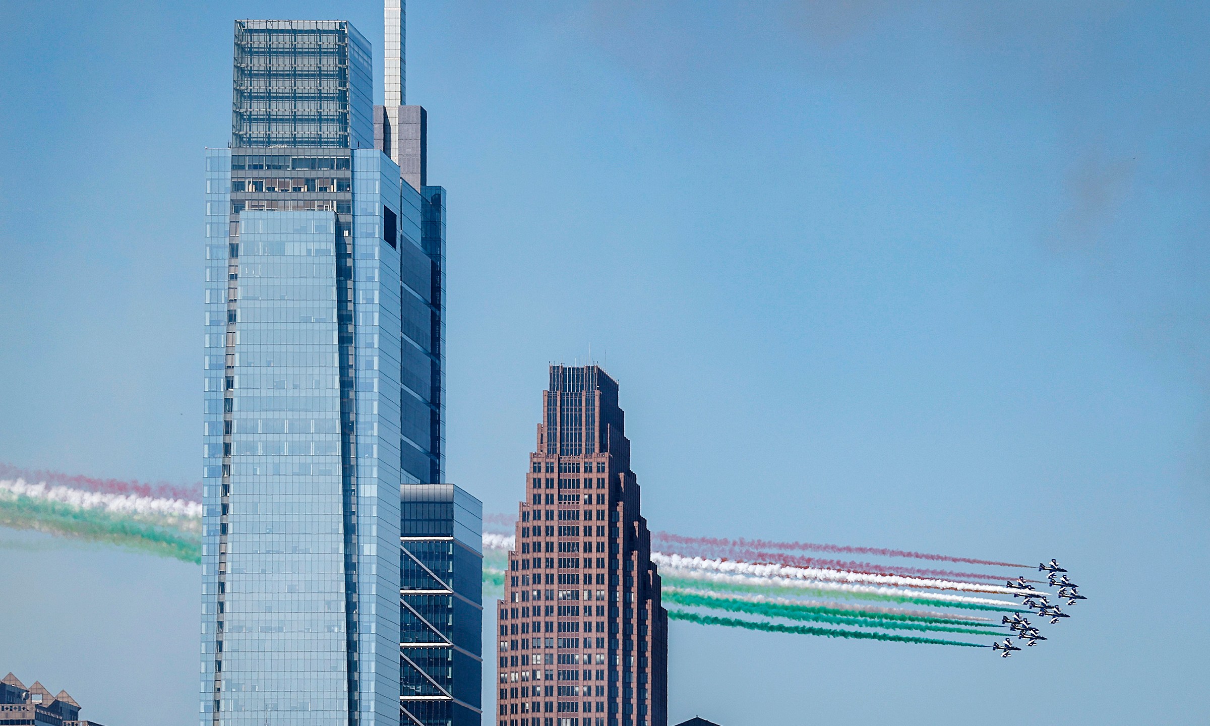 The Italian Air Force Frecce Tricolori flies over Center City Philadelphia on Monday, Aug. 12, 2024. (Yong Kim/The Philadelphia Inquirer via AP)