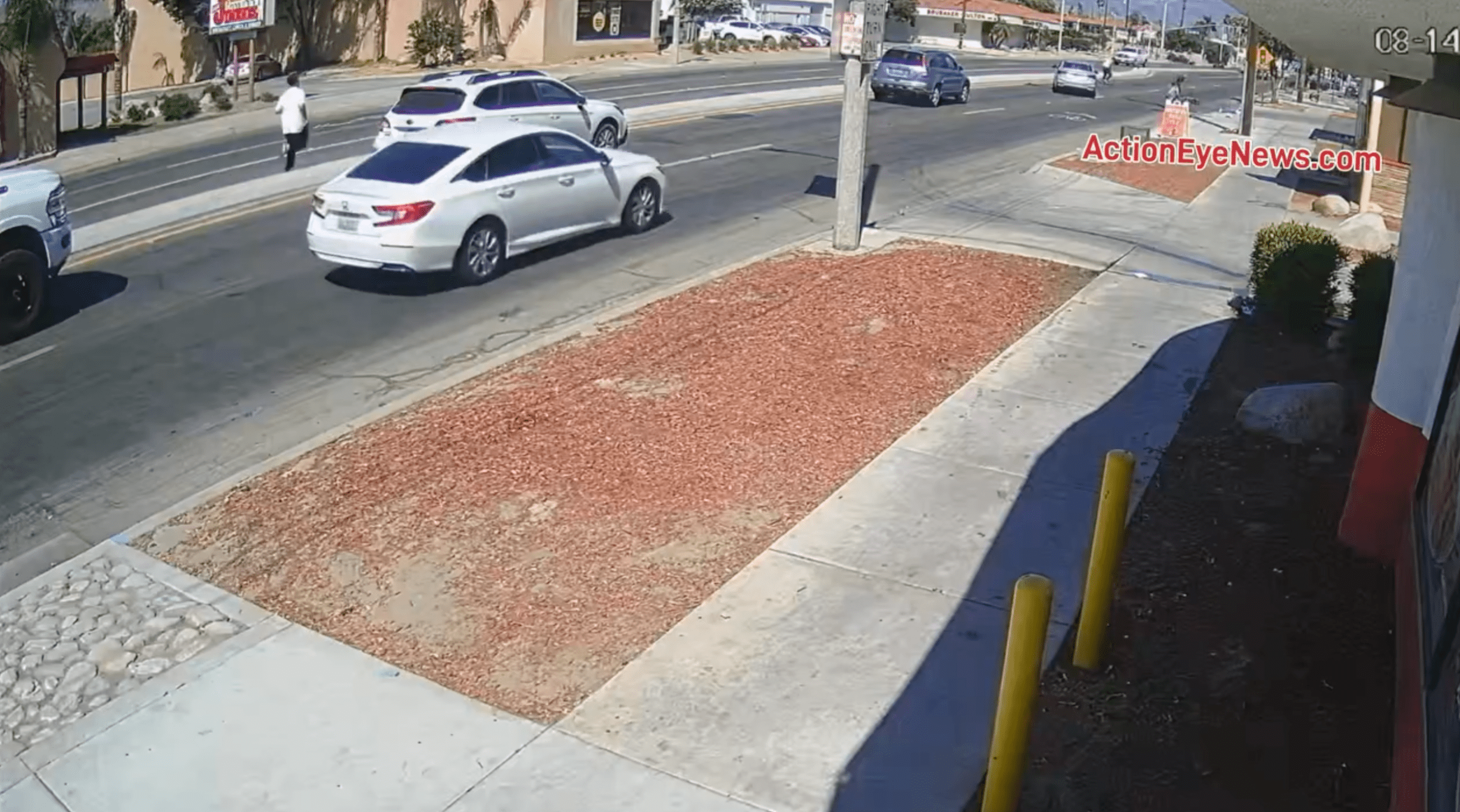 The suspect, in a white t-shirt, flees the scene after shooting two men in Hemet on Aug. 14, 2024. (Action Eye News)