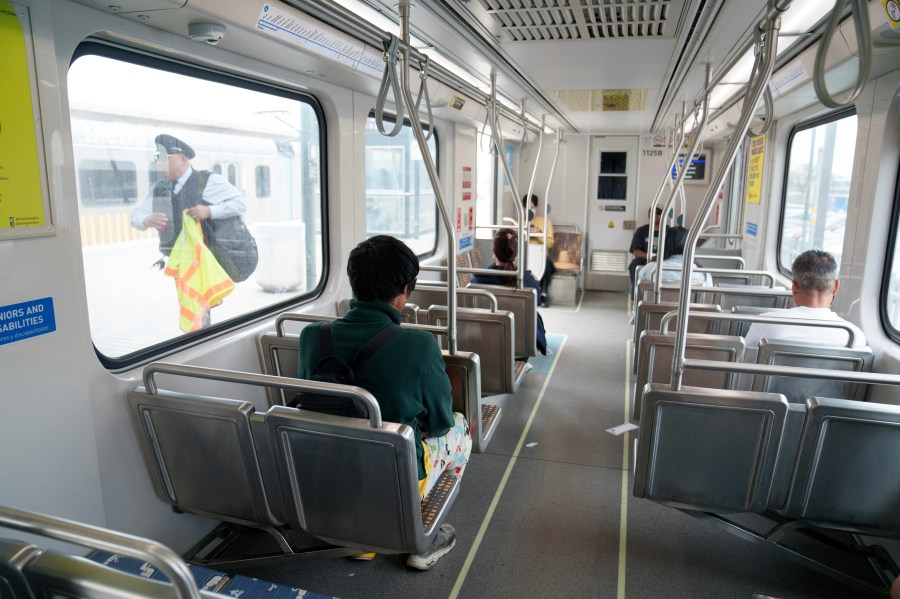Commuters ride the Metro