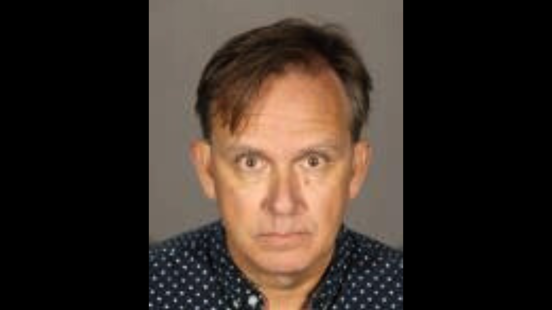 The suspect, Stephen Nathanial Risdon, is seen in a booking photo from the Glendale Police Department.
