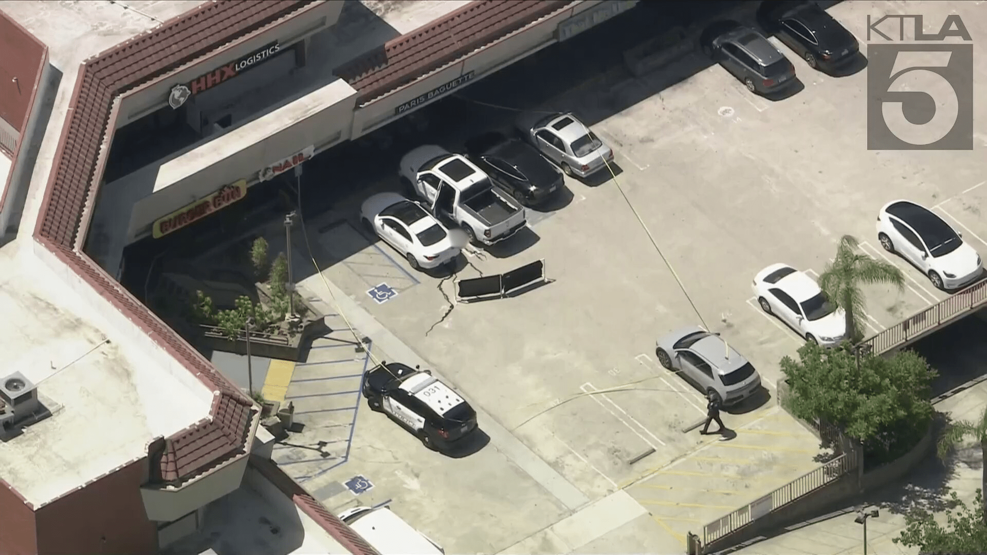 The victim was found lying on the ground next to his white pickup truck at a Glendale parking lot on August 15, 2024. (KTLA)