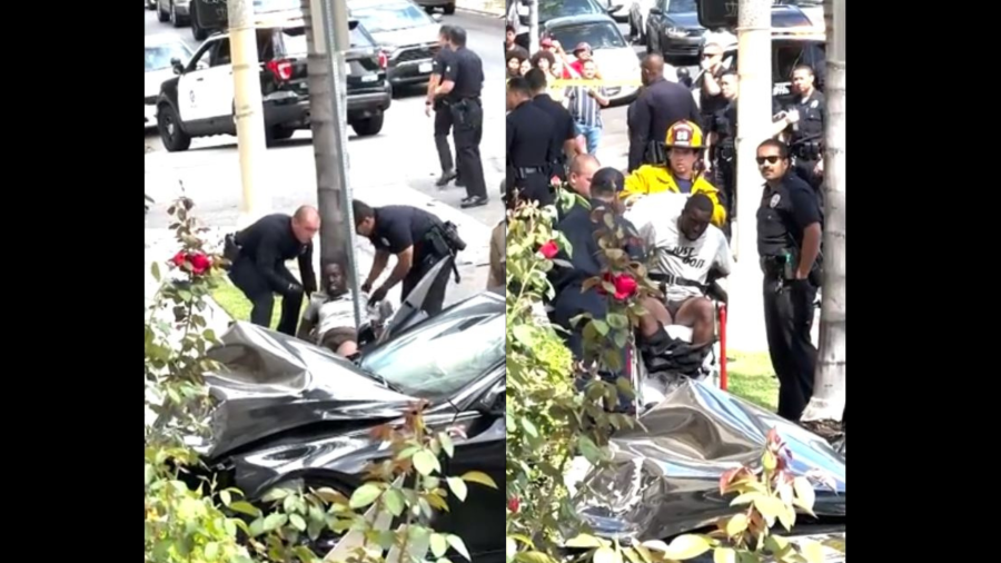 A male suspect being transported to the hospital for injury treatment after a high-speed pursuit crash in Koreatown on August 1, 2024. (@laurenorion)