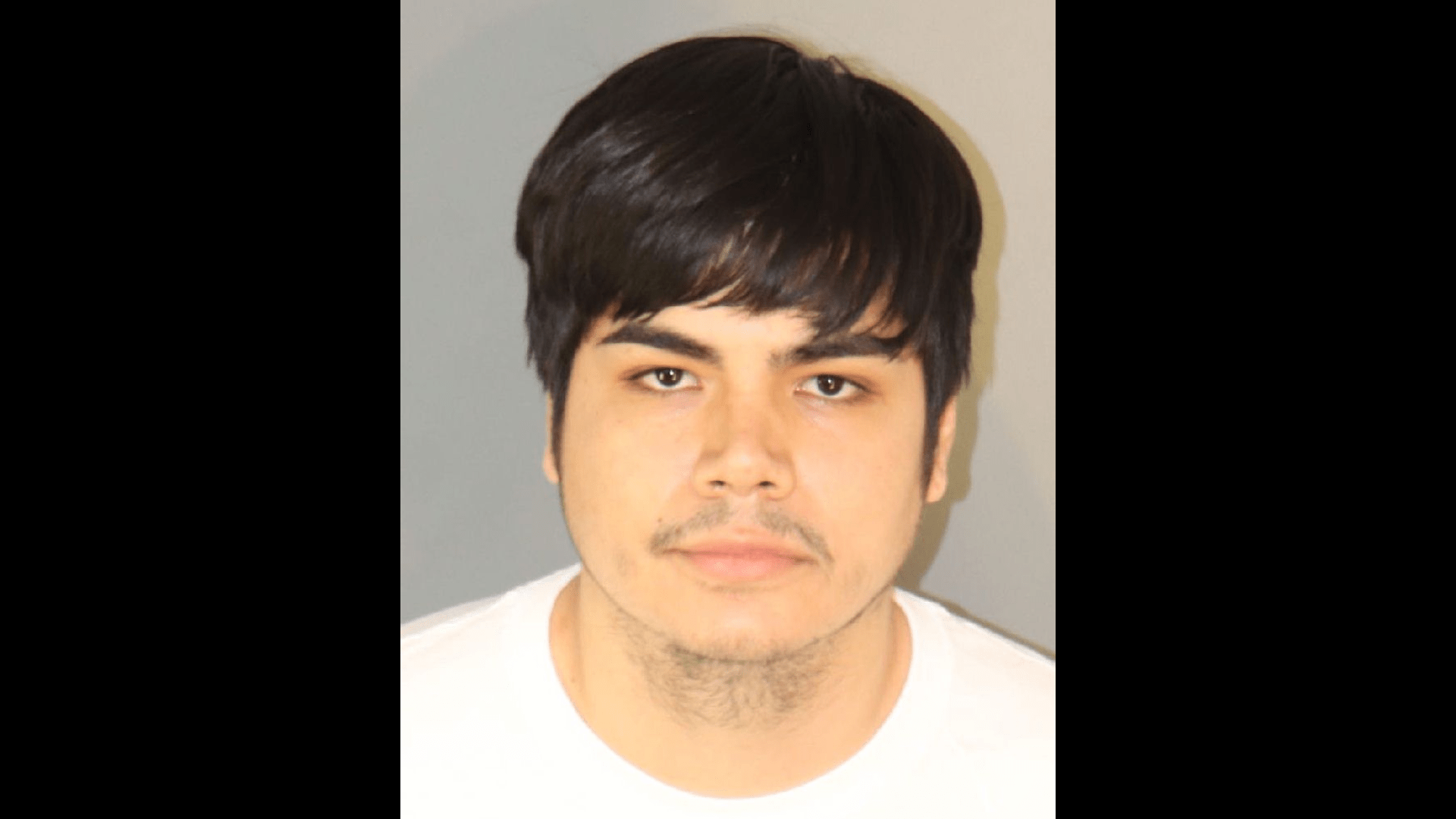 The suspect, Andres Laris, 23, from Riverside, is seen in a booking photo from the Riverside Police Department.