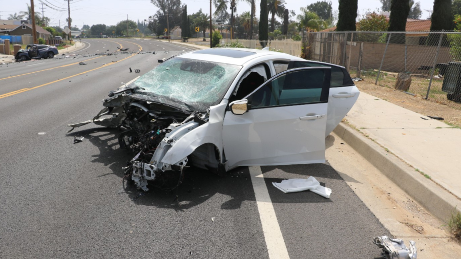 The suspect's white Honda was totaled after colliding head-on with another vehicle in a deadly Riverside crash on May 16, 2023. (Riverside Police Department)