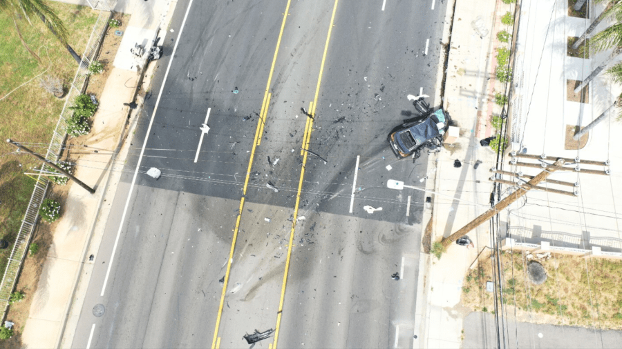 Four victims were inside the gray Nissan sedan when the suspect crashed head-on into them. The impact killed an 8-year-old boy and left three others seriously injured in Riverside on May 16, 2023. (Riverside Police Department)