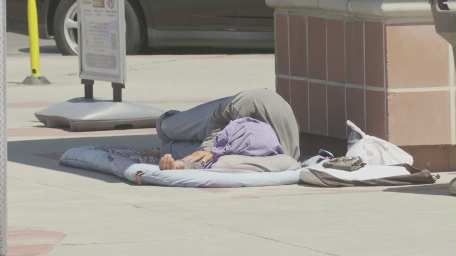 Homeless residents seen at the Newport Beach Pier area on August 29, 2024. (KTLA)