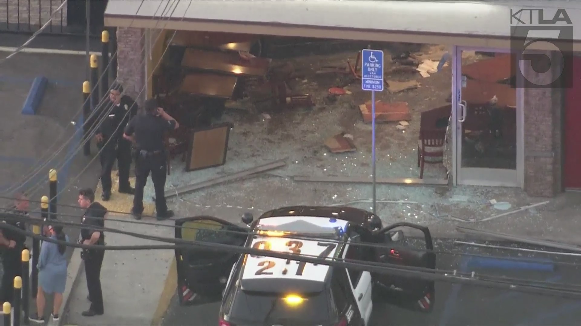 A woman was arrested after intentionally crashing her car into a taco shop in Canoga Park on August 9, 2024. (KTLA)