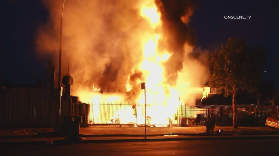 Firefighters battle a large blaze in front of a South L.A. tire shop on August 2, 2024. (OnScene.TV)