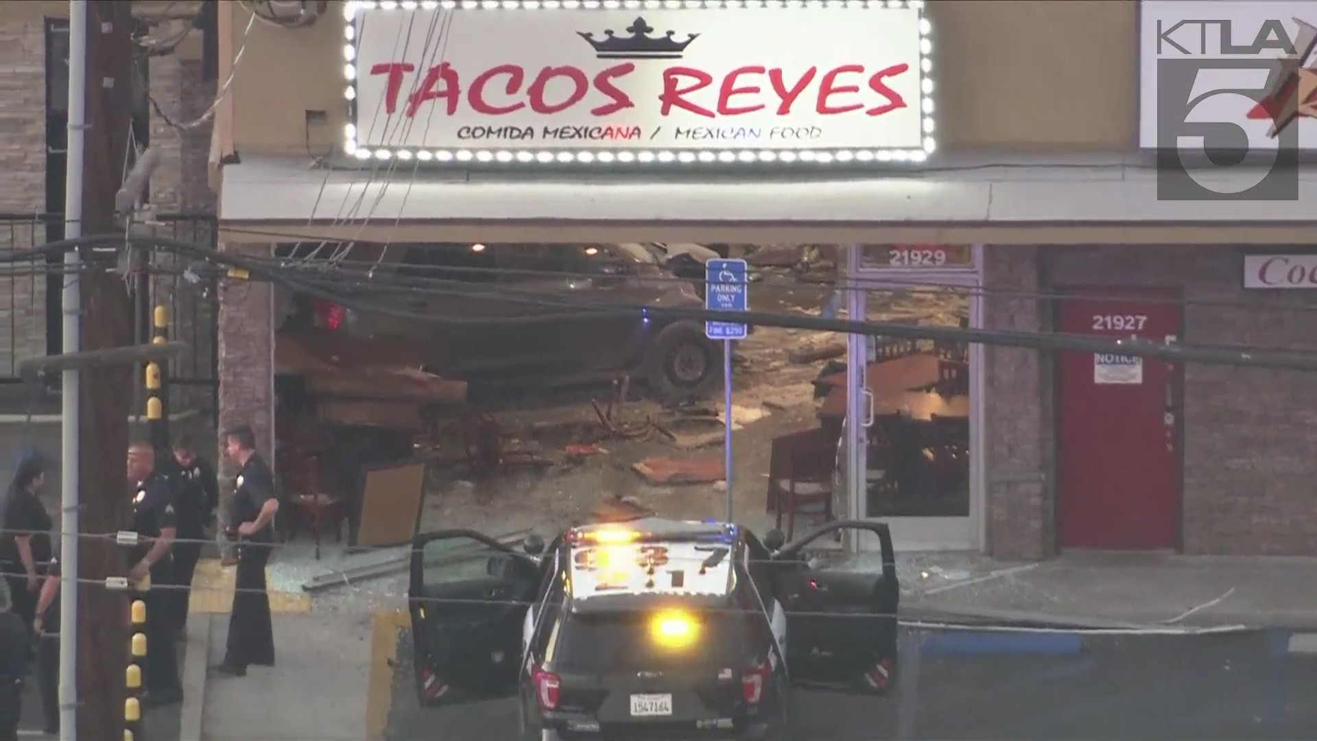 A woman was arrested after intentionally crashing her car into a taco shop in Canoga Park on August 9, 2024. (KTLA)