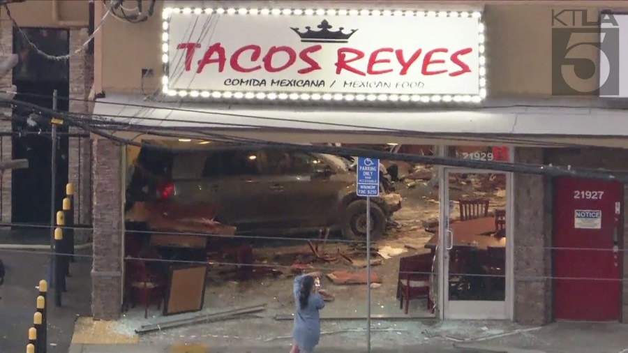 A woman was arrested after intentionally crashing her car into a taco shop in Canoga Park on August 9, 2024. (KTLA)