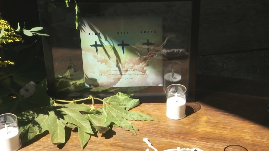 A memorial table honoring the victims of the deadly 2023 mass shooting at Cook's Corner bar in Trabuco Canyon. (KTLA)