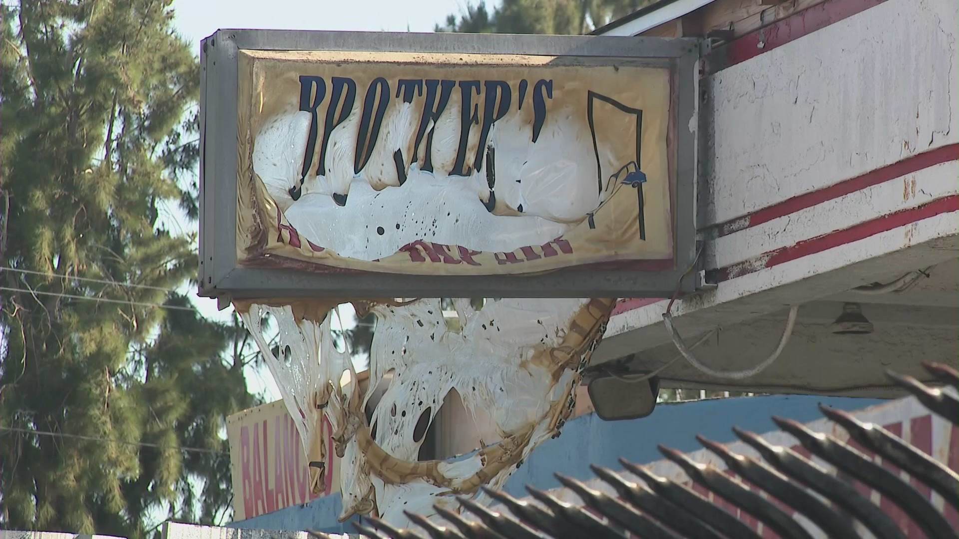 An auto shop next door, Brothers Auto Repair, was also damaged by the fire. (KTLA)