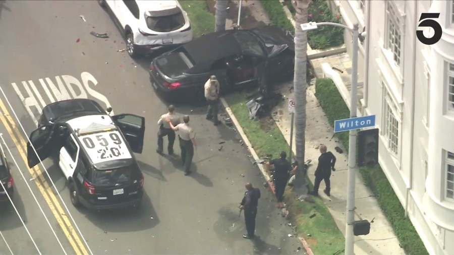 A suspect in a reportedly stolen BMW was arrested after a high-speed pursuit ended in a crash in Koreatown on August 1, 2024. (KTLA)