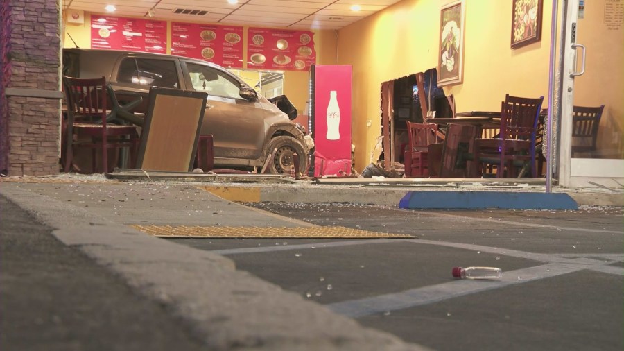 A woman was arrested after intentionally crashing her car into a taco shop in Canoga Park on August 9, 2024. (KTLA)