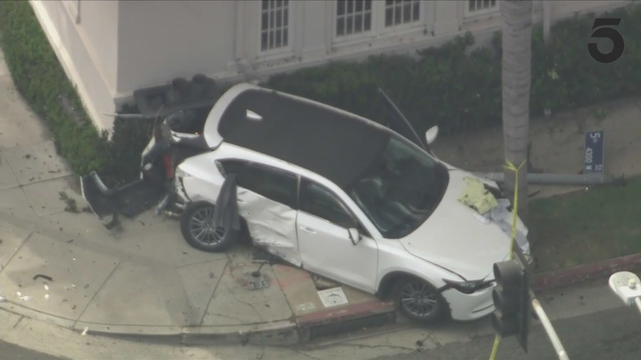 A victim's white Mazda was T-boned by the suspect during a pursuit crash in Koreatown on August 1, 2024. (KTLA)