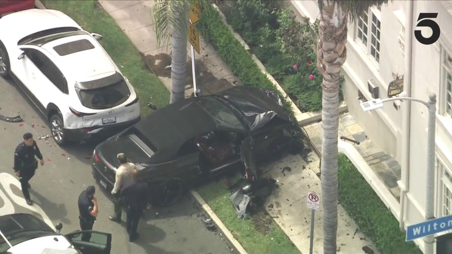 A suspect in a reportedly stolen BMW was arrested after a high-speed pursuit ended in a crash in Koreatown on August 1, 2024. (KTLA)