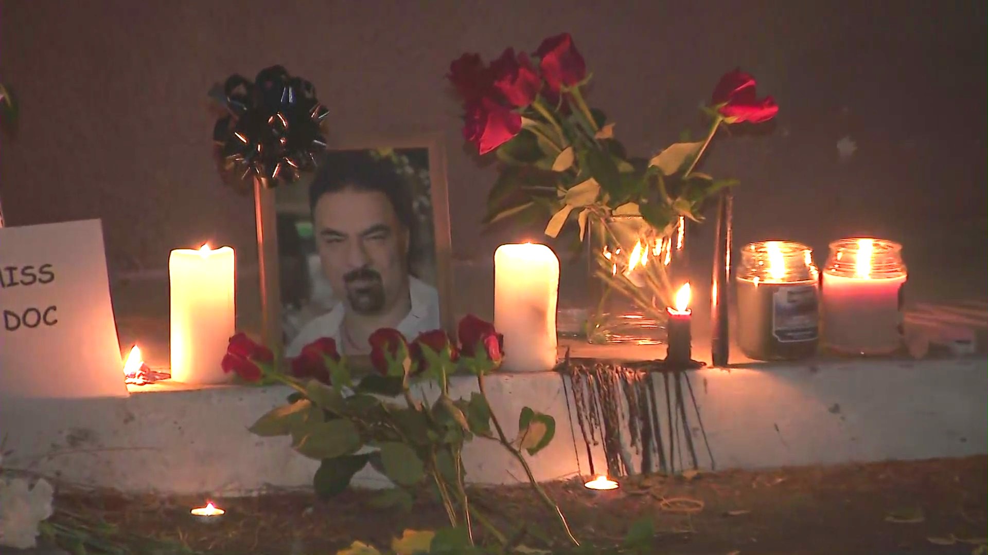A growing memorial seen outside a Woodland Hills clinic honoring Hamid Mirshojae on August 24, 2024. (KTLA)