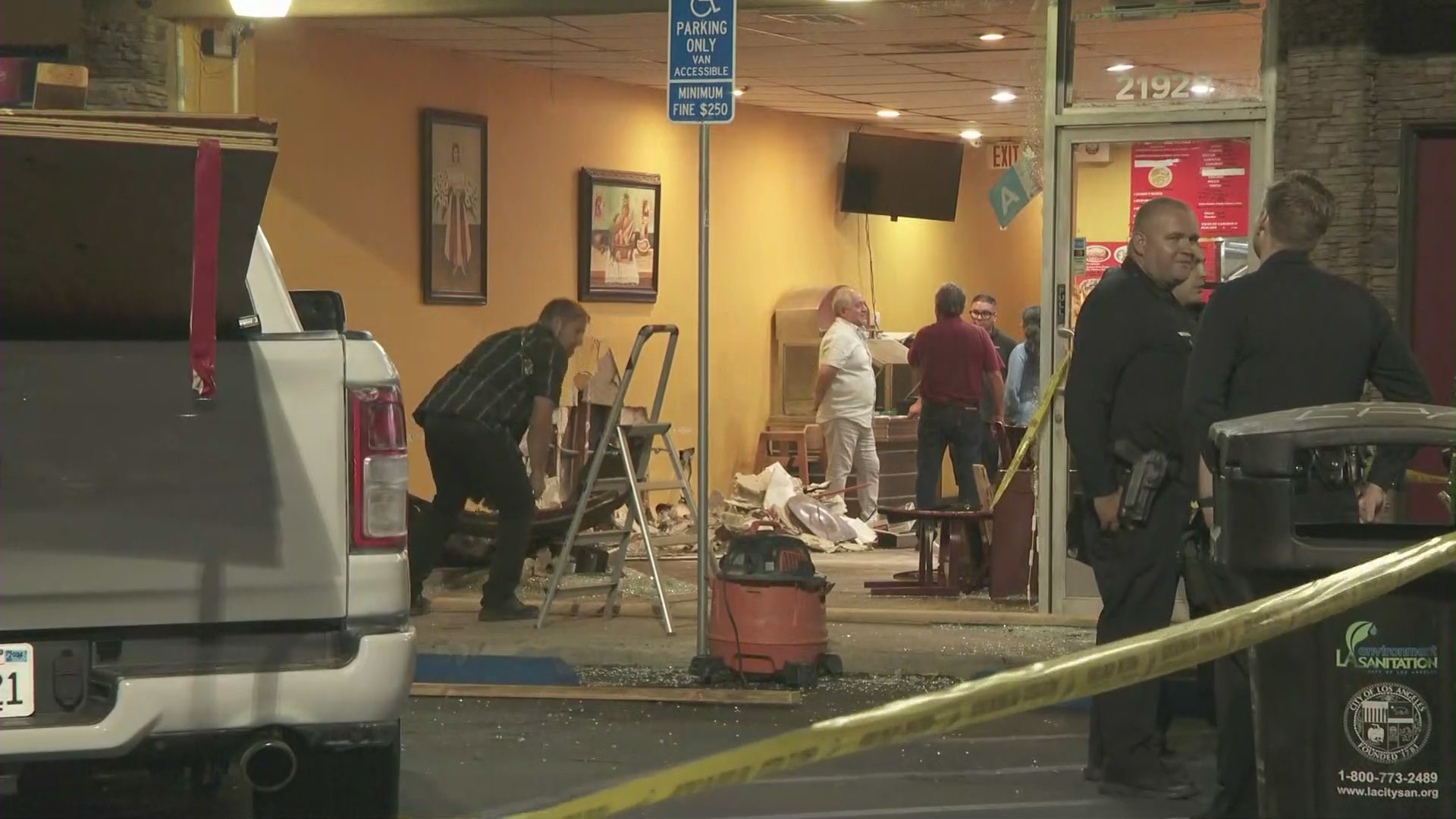 A woman was arrested after intentionally crashing her car into a taco shop in Canoga Park on August 9, 2024. (KTLA)