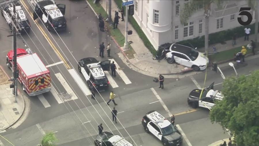 A suspect in a reportedly stolen BMW was arrested after a high-speed pursuit ended in a crash in Koreatown on August 1, 2024. (KTLA)