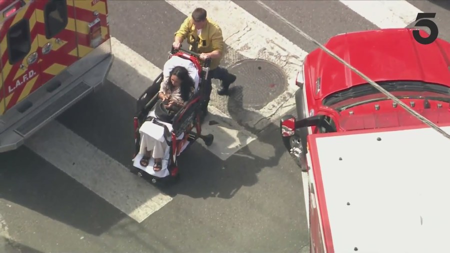 The female driver of the white Mazda was transported to the hospital for injury treatment. (KTLA)