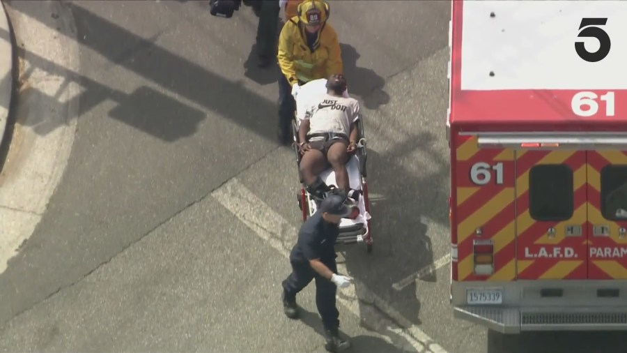 The male suspect was transported to the hospital for injury treatment. (KTLA)
