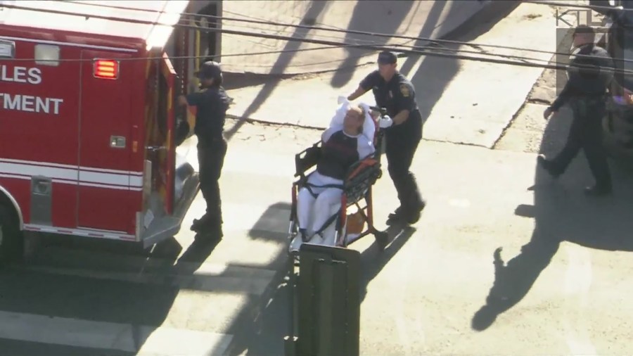 The female suspect was reportedy injured and wheeled out into an ambulance on August 16, 2024. (KTLA)