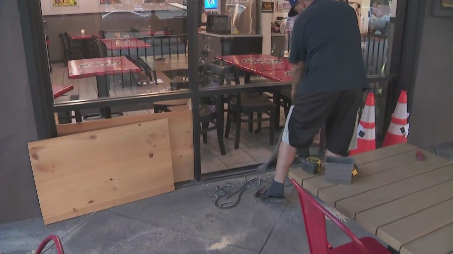 The owners of Teriyaki Madness restaurant are working to clean up the destruction left behind by a burglar. (KTLA)