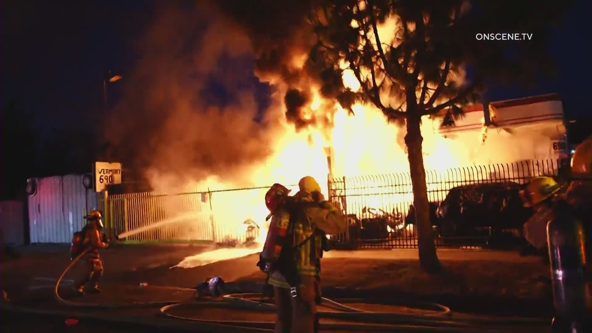 Firefighters battle a large blaze in front of a South L.A. tire shop on August 2, 2024. (OnScene.TV)
