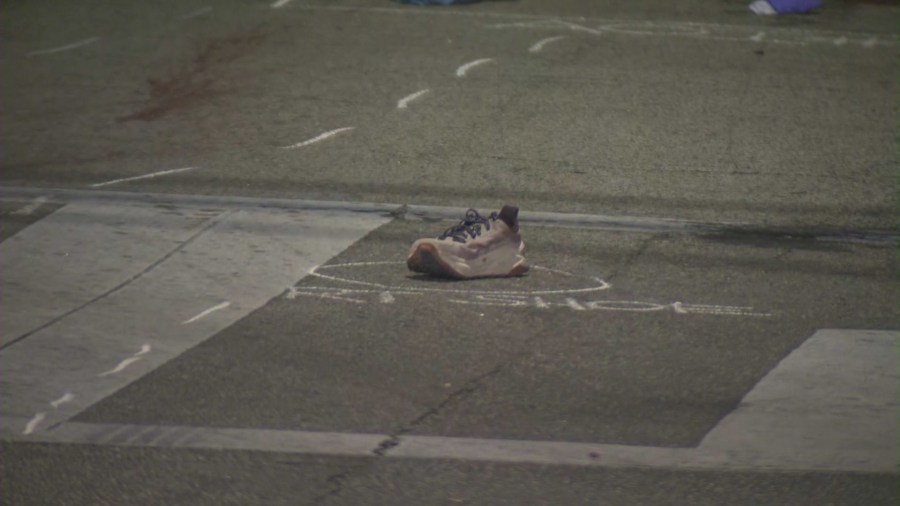 The victim's running shoe can be seen at the crash site. (KTLA)